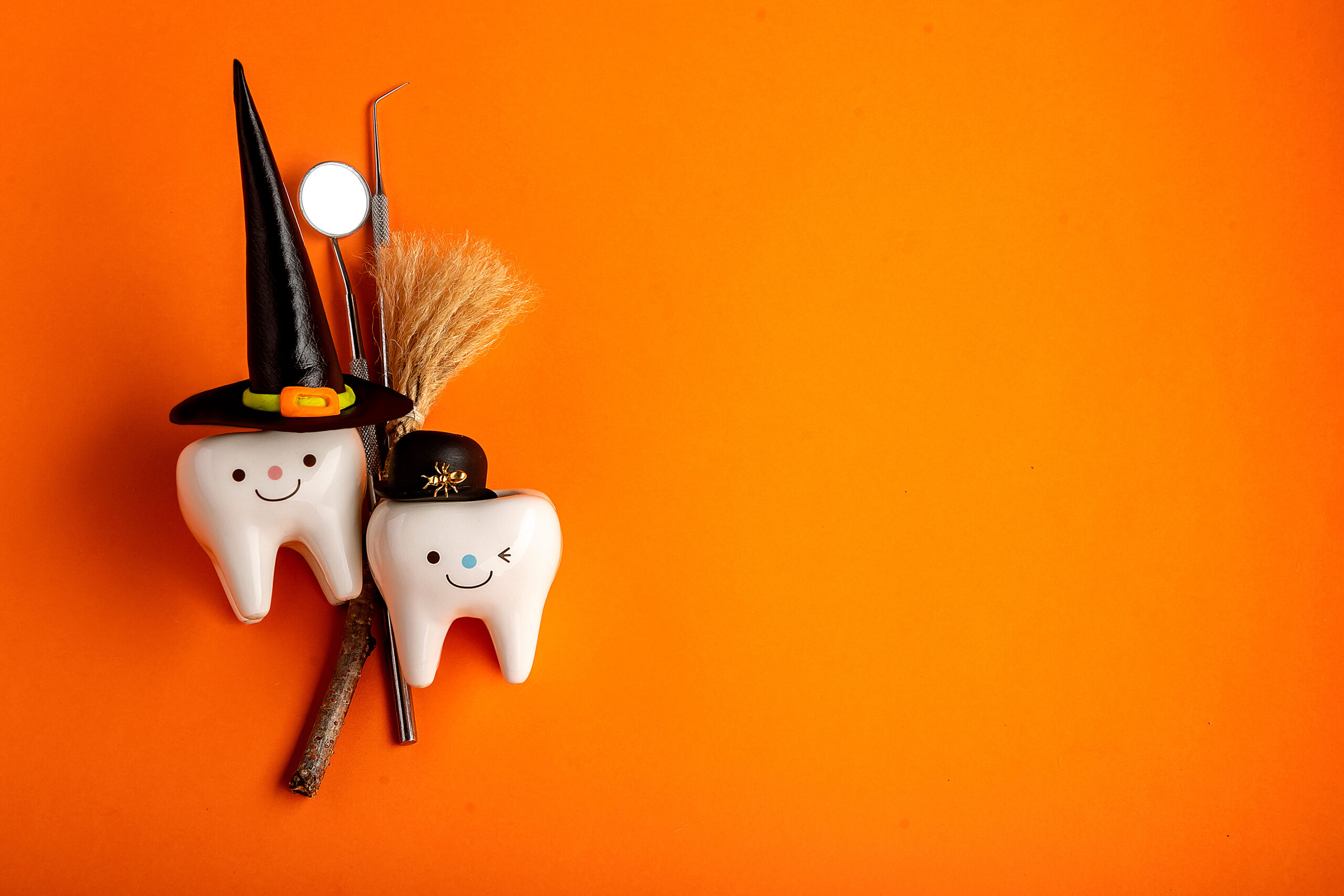 Happy halloween.dental concept.spider web pumpkin.dental tools on orange