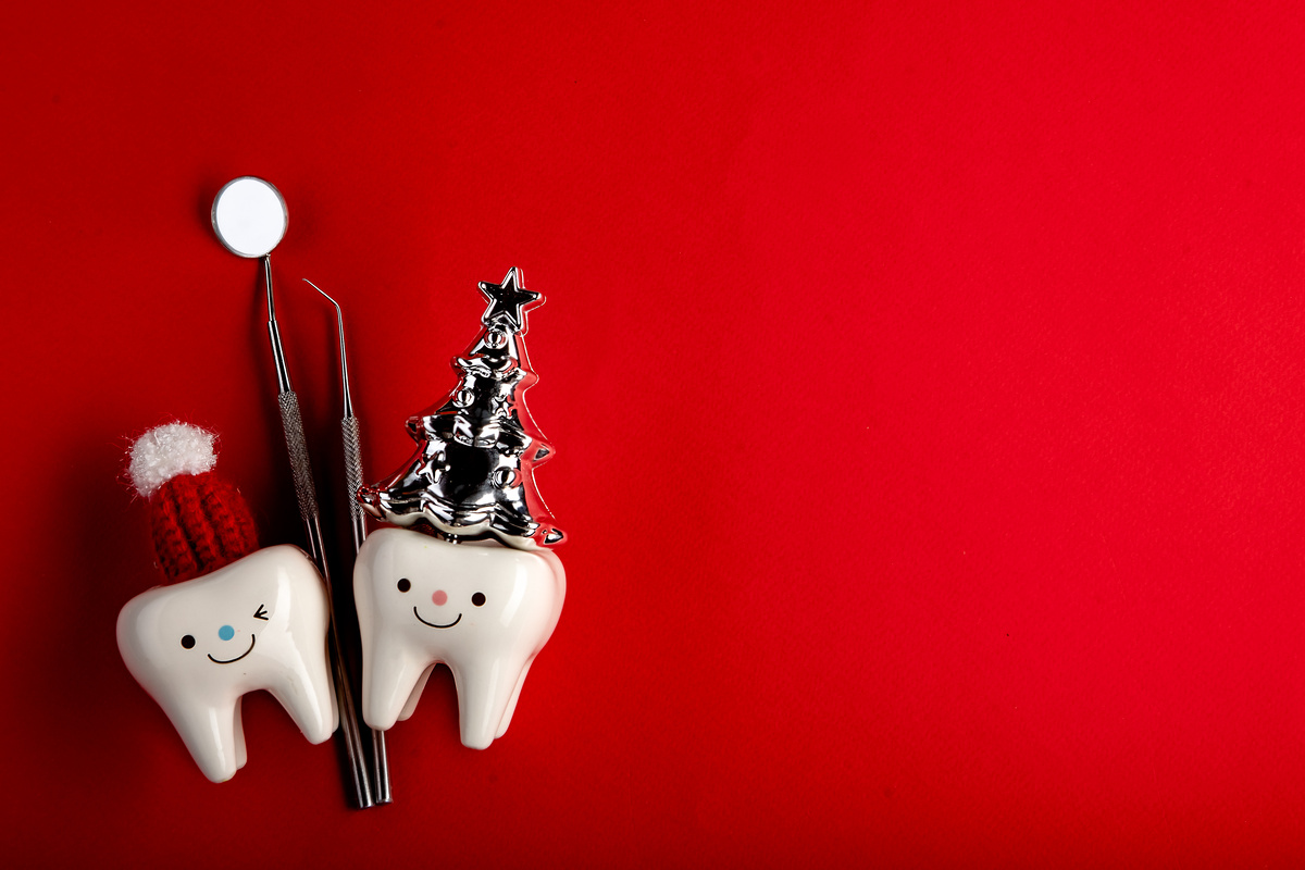 Tooth figurines and dental tool for christmas and new year 2023, top view. holiday medical concept