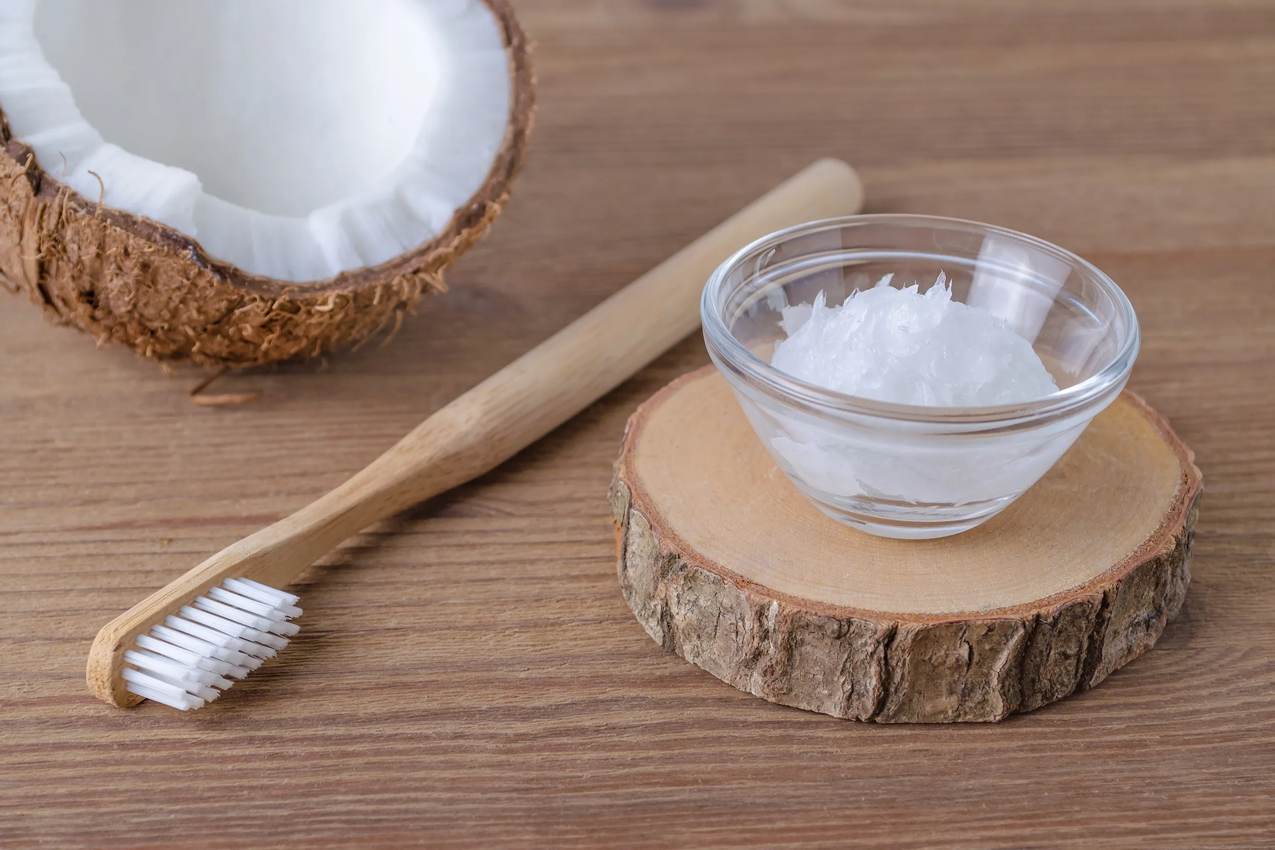 Bottle of coconut oil used for the oil pulling oral health trend